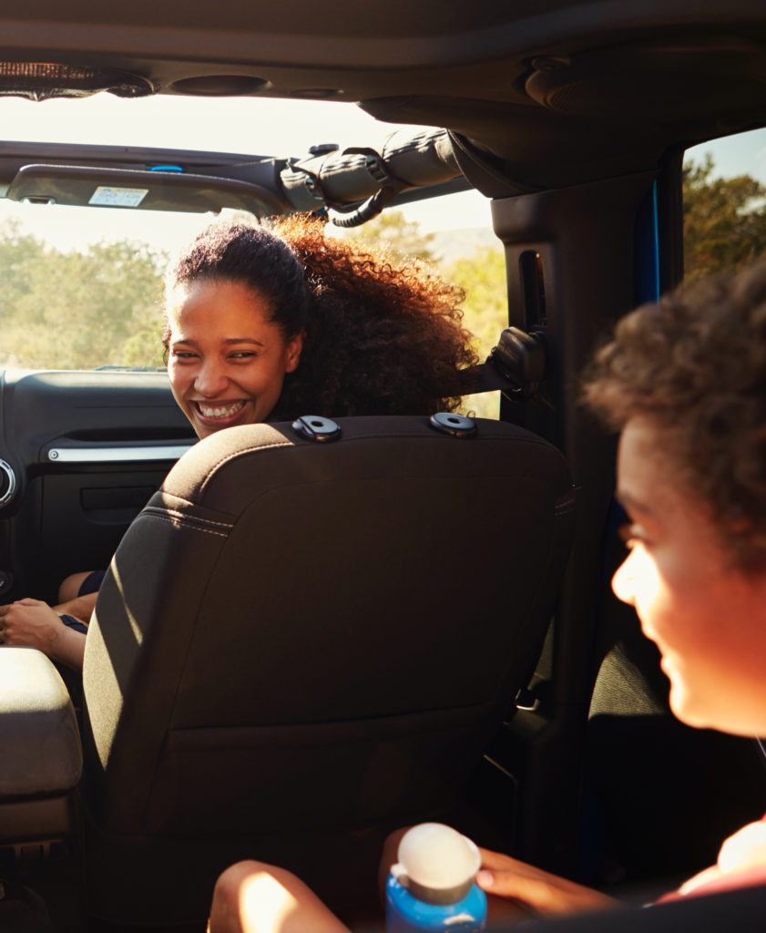 Mom looking at her kid in the car