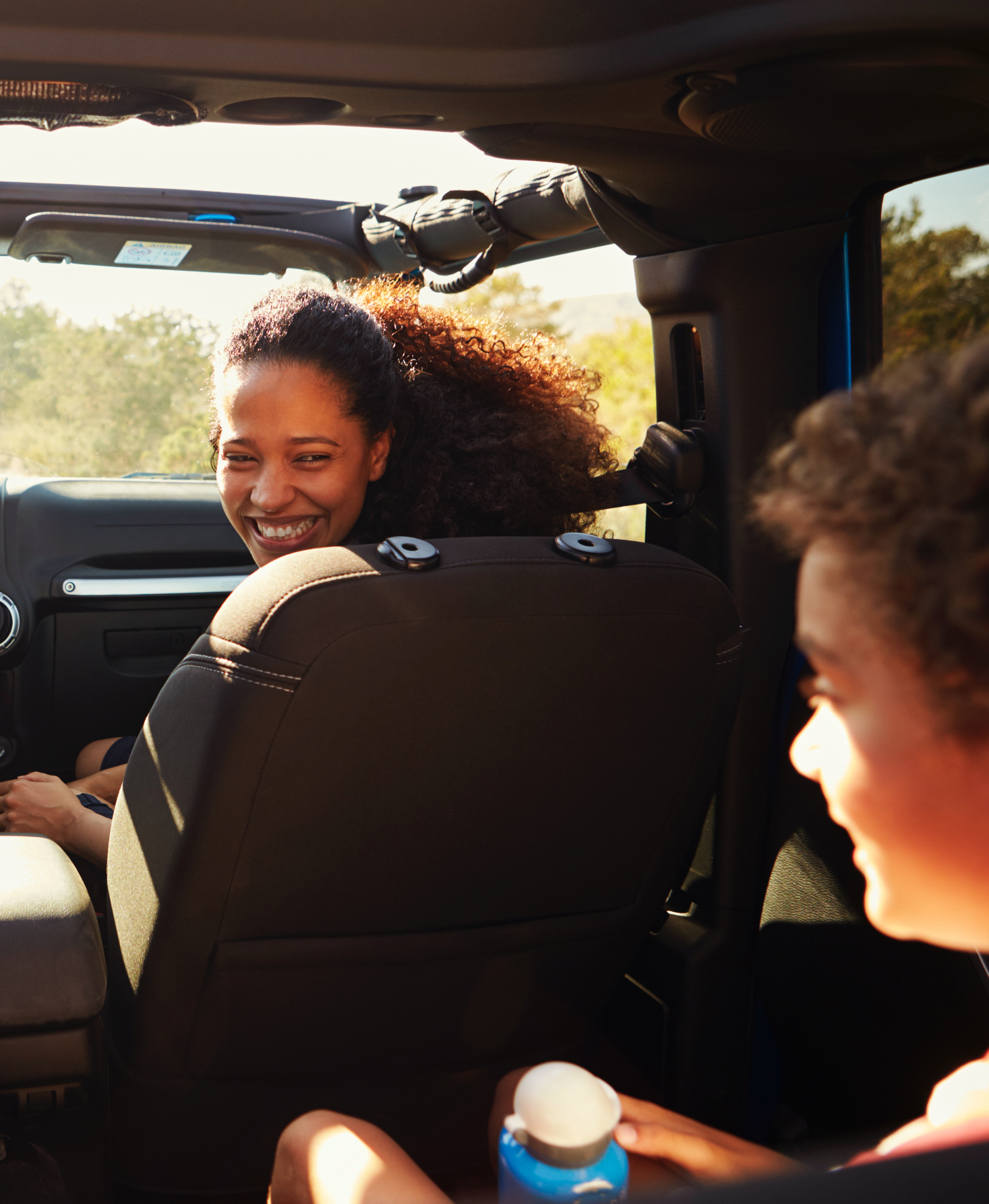 Mom looking at her kid in the car